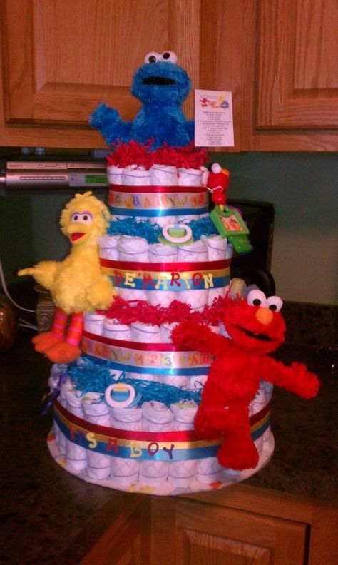 Sesame Street diaper cake Baby Elmo, Glass Head, Towel Cakes, Diaper Cake Boy, Baby Shower Diaper Cake, Baby Diaper Cake, Tips For Success, Baby Shower Diapers, Diaper Cakes