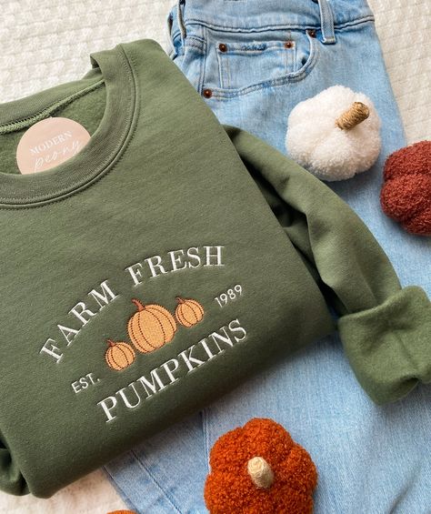 FALL Embroidered sweatshirt, Pumpkin Crewneck Sweatshirt Farm Fresh Pumpkin Patch, Pumpkin Sweater, Autumn Shirt Thanksgiving Sweatshirt,  ---HOW TO ORDER---   FOR EACH SHIRT CHOOSE: **Shirt type, size and color ---UNISEX SIZING--   Please see size chart in the pictures ---PRODUCT DETAILS--- Gildan Crewneck UNISEX Sweatshirt 50% cotton, 50% polyester Pre-shrunk Air jet yarn for softer feel and reduced pilling Double-needle stitched collar, shoulders, armholes, cuffs, and hem Gildan Crewneck UNIS Autumn Shirts Women, Sweatshirt Prints Ideas, Fall Embroidered Shirts, Pumpkin Crewneck, Farm Fresh Pumpkins, Autumn Shirts, Cute Sweater Designs, Fall Graphic Sweatshirt, Fall Etsy Ideas