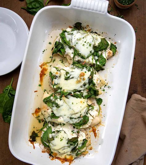 This Chicken Spinach Bake is seasoned chicken breasts topped with a garlic and herb cream cheese mixture, fresh spinach, and melted mozzarella, baked to perfection. It is a flavorful dish that is great for any occasion! And, it is as easy to assemble as it is delicious! Chicken One Pot Meals, Garlic And Herb Cream Cheese, Chicken Spinach Bake, Chicken And Spinach Casserole, Baked Garlic Chicken, Garlic Cream Cheese, Herb Cream Cheese, Cream Cheese Spinach, Greek Yogurt Chicken