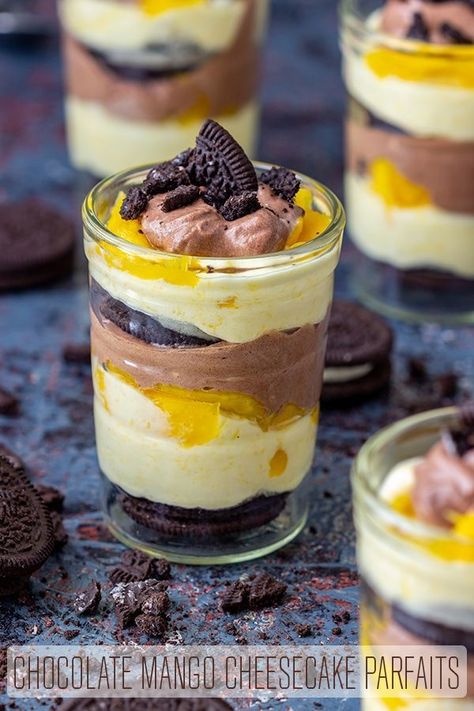 This chocolate mango cheesecake parfait recipe is perfect for summer. A combination of Oreo cookies, fresh mango slices, chocolate and mango cheesecake layers! So easy and tasty. #happyfoodstube #chocolate #mango #dessert #parfait #recipe #oreo #cheesecake via @happyfoodstube Cheesecake Parfait Recipes, Cheesecake Parfait, Mango Slices, Raspberry No Bake Cheesecake, Mango Chocolate, Parfait Recipe, Fruity Recipes, Cheesecake Parfaits, Fried Oreos