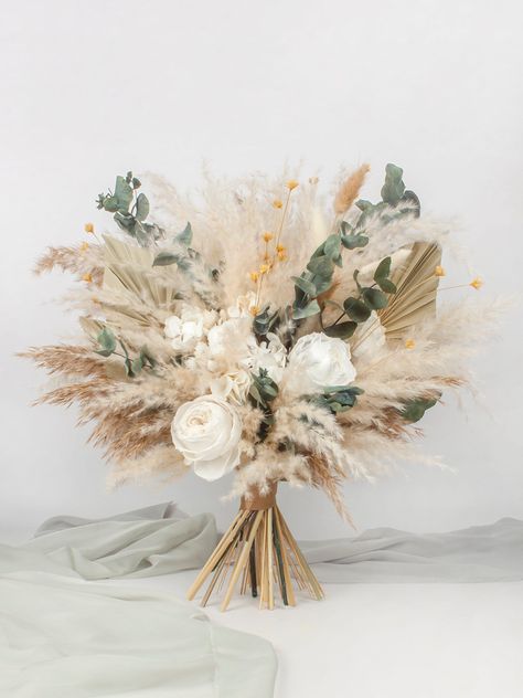 "A wonderful base bouquet that will bring joy and beauty for a very long time. Thanks to completely natural materials and processing, the flowers retain their luxurious appearance and even a light aroma. This incredibly aesthetic decoration will create that wonderful festive and cozy atmosphere. Can be used as a decoration for a wedding, or another party, or as decor anywhere. ⭐Flowers Used:  Preserved roses,preserved hydrangea,palm leaves,mountain flower,silvery chrysanthemum,pampas grass,prese Pampas Rustic Wedding, Tan And White Flower Bouquet, Diy Pampas Grass Bouquet, Boho Style Wedding Bouquet, Boho Wedding Bouquet Pampas, Boho Beach Bouquet, Wedding Without Bouquet, Spring Boho Wedding Flowers, Pampas Bouquet Wedding