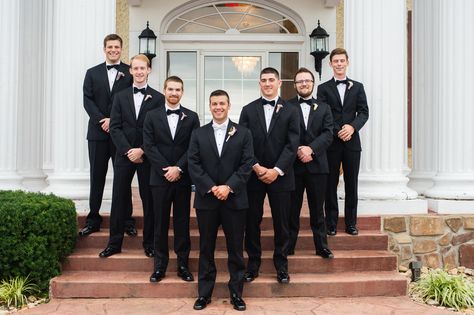 Classic Black Groomsmen Tuxedos and Bow Ties Black Bow Tie Groomsmen, Black Vest Men, Black Tuxedo White Bow Tie, Classic Black Tuxedo With Bow Tie, Groomsmen Black Suit Bowtie, Groom Black Suit Bow Tie, Classic Tuxedo With Satin Bow For Black-tie Events, Black Groomsmen, Tuxedo Bow Tie