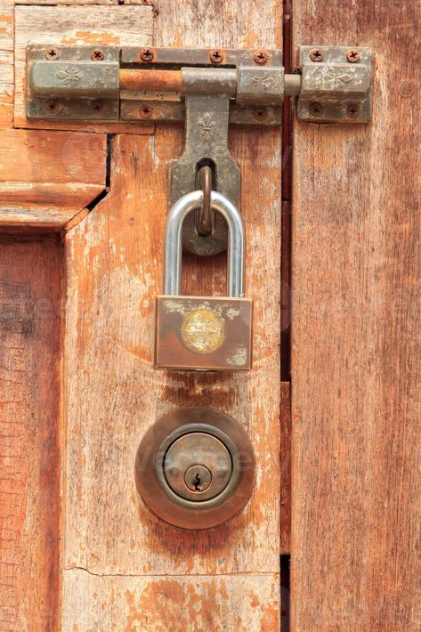 Brown wooden door has a key and a lock and a handle for locking the door to prevent thieves and thieves from stealing your belongings and valuables. It is an ancient wooden door Wooden Doors, The Door, Doors, Key