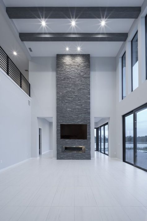 Modern Floor To Ceiling Fireplace, Inside Of Modern Homes, Stone Fireplace Floor To Ceiling Modern, Tv Wall Design Tall Ceiling, Floor To Ceiling Fireplaces, Double Story Fireplace Wall, Tall Tv Wall, Modern Tall Fireplace High Ceilings, Small High Ceiling Living Room Modern