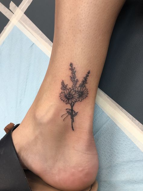 My Daisy and Heather bouquet ankle tattoo. (Our wedding flower and my name.) Flower Bouquet Tattoo Cover Up, Chrysanthemum Tattoo Ankle, Tattoo Flower Cover Up, Ankle Daisy Tattoo, Small Ankle Tattoo Cover Up, Daisy Tattoo Cover Up Ideas, Birth Flower Tattoo Ankle, Ankle Small Tattoo, Daisy Tattoo On Ankle