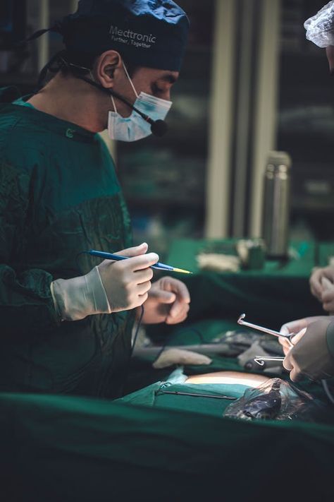 Surgeon performing a Surgery on a Patient · Free Stock Photo Rich Surgeon Lifestyle, Surgeon Pictures, Orthopaedic Surgeon Aesthetic, Orthopedic Surgeon Aesthetic, Operating Room Aesthetic, Cardio Surgeon Aesthetic, Female Surgeon Aesthetic, Heart Surgeon Aesthetic, Surgery Wallpaper