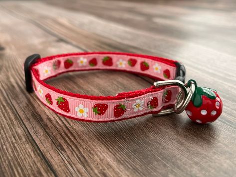 "This adorable pink & red Strawberry Collar is a cute collar that will draw much adoration from your pet's fans. This lightweight tiny pet collar is available in a breakaway cat collar or mini teacup dog collar. 💙 Spoiling your pet has never been so easy! Size Chart: 📏 Please measure your pet's neck prior to ordering to ensure you're getting the best fit. All collars are adjustable and the length is noted within each listing. Cat 1/2\"W (8-12\"L) Mini Dog 1/2\"W (7-11\"L) Small Dog 5/8\"W (10-15\"L) Medium Dog 3/4\"W (12-17\"L) Medium Dog 1\"W (13-18\"L) Large Dog 1\"W (15-21\"L) X Large Dog 1\"W (18-28\"L) Construction: 🪡 A Box X Stitch is sewn on every collar and leash. The benefit of this reinforced stitch will give you peace of mind to know the collar will hold up to the pull of the Cute Dog Leashes And Collars, Strawberry Dog Collar, Red Cat Collar, Cute Pet Collars, Dog Collars Aesthetic, Cute Cat Collars Aesthetic, Coquette Dog Collar, Pink Dog Stuff, Cat Collar Aesthetic