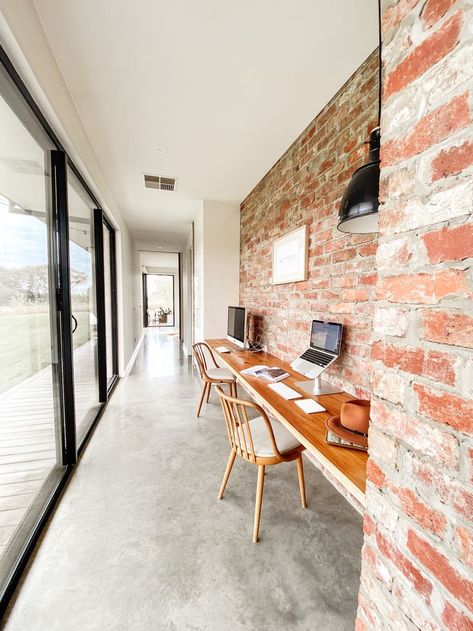 Our recycled red brick wall is strategically placed to improve thermal mass. In winter, the sun comes in under the north eave warming the bricks and concrete floor providing us with free natural heating. Red Brick Interior, Brick Feature Wall, Sydney House, Sustainable House, Brick Interior Wall, Red Brick Wall, Brick Interior, Recycled Brick, Thermal Mass