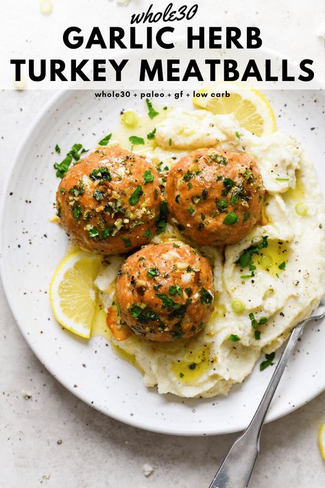 These baked whole30 garlic herb turkey meatballs are a tasty protein rich main dish that are made with ground turkey, fresh herbs, garlic, lemon, and ghee. Perfectly balanced, cooked to perfection, and made without cheese or breadcrumbs. Whole30, paleo, gluten free, low carb + keto friendly. #whole30recipes #turkeymeatballs #glutenfreedairyfree #lowcarb #ketofriendly Whole 30 Turkey, Garlic Herb Turkey, Whole30 Turkey Meatballs, Paleo Turkey Meatballs, Turkey Meatballs Recipe, Paleo Turkey, Ground Turkey Meatballs, Gluten Free Turkey, Turkey Meatballs Baked