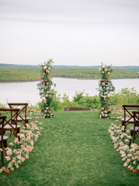 alter looking out to lake with floral poles pink and orange greenery wedding day dark wooden chairs for guests Waterfront Wedding Altar, Ceremony Installation, Wedding On The Water, Carlton Landing, Wedding Altars, Oklahoma Wedding, Waterfront Wedding, Breathtaking Wedding, Contemporary Romances