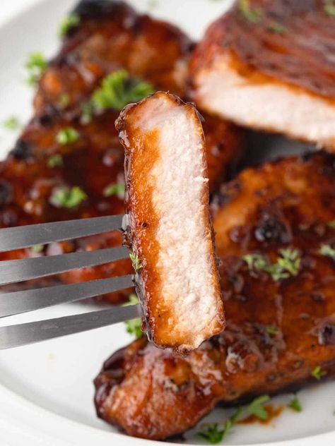 Honey Glazed Pork Chops are marinated in an irresistible honey garlic sauce, then seared and baked in the same skillet! The whole family will love this easy dinner that uses simple ingredients to create the most delicious pork chops you've ever tasted! Honey Pork Chop Recipes, Honey Garlic Baked Pork Chops, Honey Garlic Pork Chop Marinade, Honey Garlic Pork Chops Oven, Pork Chops Honey Garlic, Easy Honey Garlic Pork Chops, Brown Sugar Garlic Pork Chops, Honey Garlic Soy Sauce Pork Chops, Delicious Pork Chops