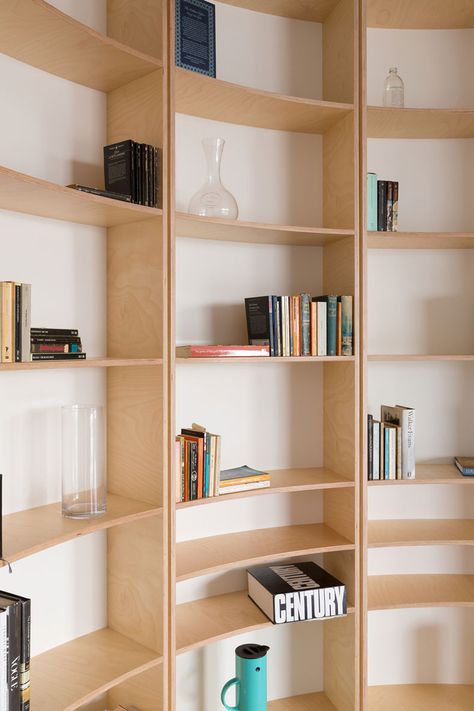 The tiny Southern Highlands House uses plywood to create a beautiful and affordable curved bookshelf. The plywood was CNC cut to shape to ensure a perfect fit. Plywood Interior, Curved Wall, Plywood Shelves, Pavilion Design, Southern Highlands, Curved Walls, Highland Homes, Book Shelf, Wooden Shelves