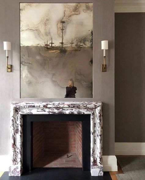 Antiqued mirror and marble fireplace @alyssakapitointeriors Mirror Over Fireplace, Wallpaper Fireplace, Farmhouse Fireplace Decor, Decoration Wallpaper, Cheap Apartment Decorating, Decor Fireplace, Marble Fireplace, Fireplace Mirror, Custom Fireplace