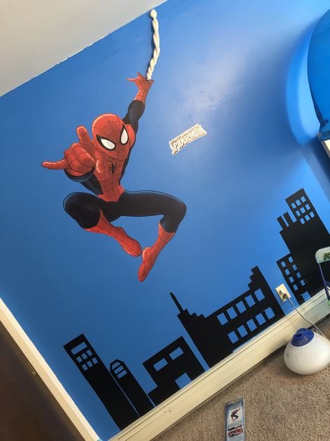 For people who live in apartments and can’t paint walls, Walmart sales wall decal material. All the building were created by hand from that material Spiderman Bedroom Ideas Kid Rooms, Spiderman Wall Art Diy, Spiderman Wall Painting, Spiderman Accent Wall, Spiderman Themed Bedroom, Spiderman Mural Bedroom, Spiderman Kids Room, Superhero Bedroom Wall Paint, Spiderman Kids Room Walmart