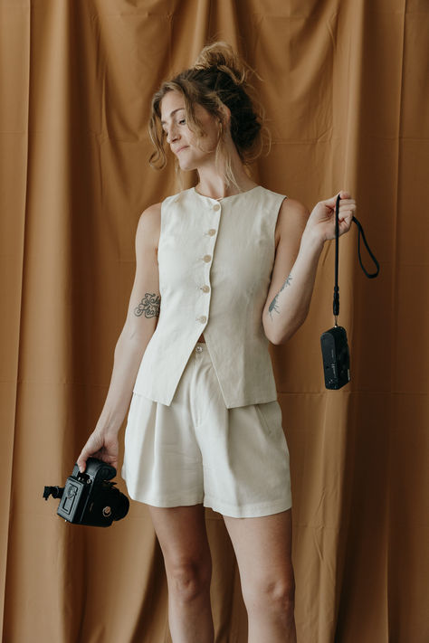 Fall outfit inspiration vest white shorts pleated cameras photographer studio Vest And Skirt Outfit, Fall Outfit Inspiration, Photographer Studio, Linen Vest, Vest Outfit, Photographer Camera, White Vest, Outfit Inspiration Fall, Photographic Studio