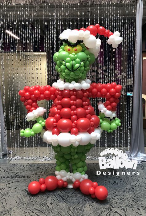 This balloon sculpture of the title character of "How the Grinch Stole Christmas" was created for a "Whoville" themed Happy Hour and Holiday Party at Building 121 on the Microsoft Campus in December 2018 Balloon Christmas Parade Float, Winterfest Ideas, Balloon Christmas Tree, Balloon Figures, Balloon Decoration Ideas, Christmas Face Painting, Balloon Christmas, Balloon Hat, Happy Balloons