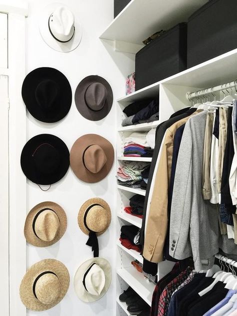 Gorgeous closet features a white modular closet system boasting clothes rails and sweater shelves next to a wall lined with stacked hat hooks. Sweater Shelves, Modular Closet System, Small Master Closet, Modular Closet, Diy Clothes Hangers, Gorgeous Closet, Make A Closet, Closet Features, Small Walk In Closet