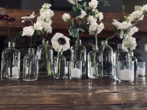 Black Vases For Centerpieces, Bud Vases Wedding Centerpiece Black And White, Black Bud Vases Wedding, Black And White Flower Centerpieces, Glass Vase Centerpiece Wedding, White Bud Vases Wedding, Anemone Bud Vase Centerpiece, Anemone Wedding Centerpiece, Wedding Round Table Flowers