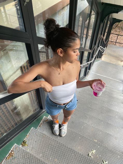 Young female wearing a white tube top with Jean shorts Tube Top Outfit With Shorts, Tube Top Outfit Casual, Bandeau Top Aesthetic, Jean Shorts And Tube Top Outfits, Comfy Tube Top Outfit, Cream Tube Top Outfit, Light Blue Tube Top Outfit, White Tub Top Outfit, White Tube Top Outfit Aesthetic