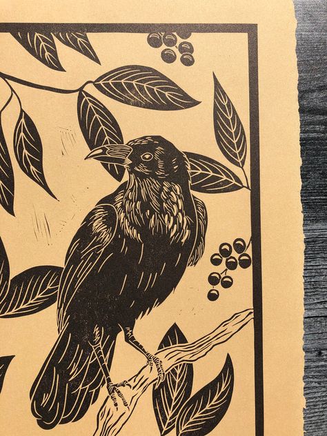 "Hand carved linocut print. This print is a crow in a tree, hand burnished in three different options. The first option is a silver crow, printed on 10.75x14\" black Legion Stonehenge paper. The second option is a black crow, printed on 11x14 Legion Stonehenge Kraft paper. The third option is a black crow printed on 16x20\" Awagami Kitakata paper, which retains all four of its deckled edges (and is just so so pretty). All are printed using Caligo Safe Wash inks. Please specify color option in dr Crow Drawing, Crows, Crow Illustration, Kraft Paper Art, Crow Poster Vintage, Linocut Crow, Crow Mural, Crow Linocut, Raven Block Print