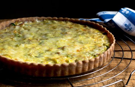 I had a beautiful bunch of leeks from the farmers’ market and a Mediterranean crust left over in my freezer from my week of savory pies, so I decided to make this lightened version of a French classic called flamiche. The French version calls for lots of butter and cream or crème fraiche. (Photo: Andrew Scrivani for The New York Times) How To Make Quiche, Leek Quiche, Onion Tart, Cheese Quiche, Nyt Cooking, Savory Pie, Quiche Recipes, Tart Recipes, Leeks