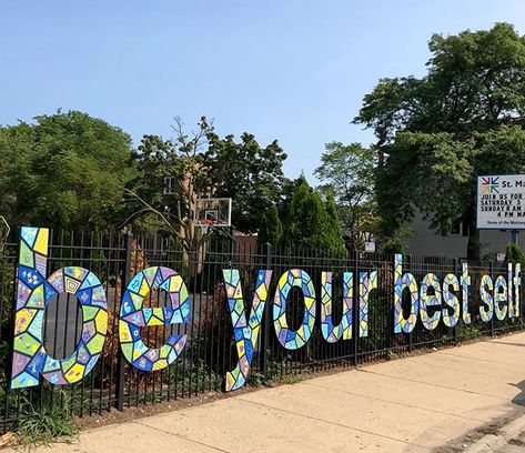 by Matthew Hoffman with the students at St.Matthias, Western & Lincoln, Chicago, ill, 8/18 (LP) Preschool Fence Ideas, School Fence Decorations, School Fence Design, Preschool Designs, Gate Decoration, Art Studio Organization, Sidewalk Art, School Murals, Iron Bench