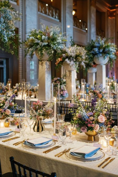 High centerpieces in a grand ballroom, featuring pastel blooms and delicate details. A stunning wedding setup. High Centerpieces, Floral Wedding Reception, Wedding Setup, Wedding Consultant, Grand Ballroom, Wedding Set Up, Delicate Details, Design Firms, Ballroom