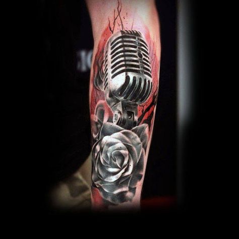 Beautiful Microphone And Rose Tattoo Mens Forearms Rockabilly Tattoo Designs, Tattoo Ideas For Men Forearm, Mic Tattoo, Music Tattoo Ideas, Microphone Tattoo, Music Tattoo Sleeves, Rockabilly Tattoo, Music Notes Tattoo, Music Tattoo Designs