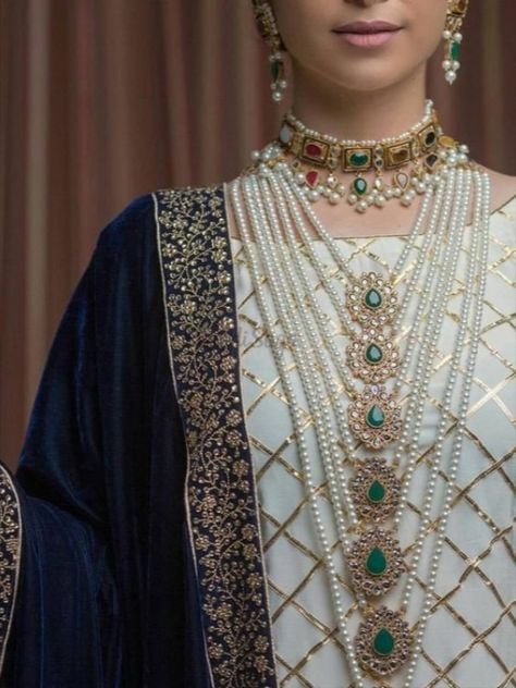 Choker Necklace when paired together with Rani Haars, the combination looks stunning! Click on the link attached below for more such Wedding jewellery, Bridal Fashion and Trends.   #indianweddings #shaadisaga #intimateweddings #bridaljewellery #bridalfashion #chokernecklace #satladahaar #panchladahaar #ranihaar #indianweddingtrends #indianbridalfashion #nawabijewellery #hyderabadijewellery Luxury Long Kundan Necklace For Party, Luxury Long Pearl Necklace In Temple Style, Elegant Zari Work Necklace For Eid, Elegant Kundan Necklace With Zari Work For Ceremonial Occasion, Elegant Meenakari Sets For Ceremonial Occasions, Elegant Kundan Sets For Ceremonial Occasions, Elegant Meenakari Bridal Sets For Eid, Elegant Bridal Necklace With Zari Work For Eid, Elegant Bridal Sets With Zari Work For Ceremonial Occasion