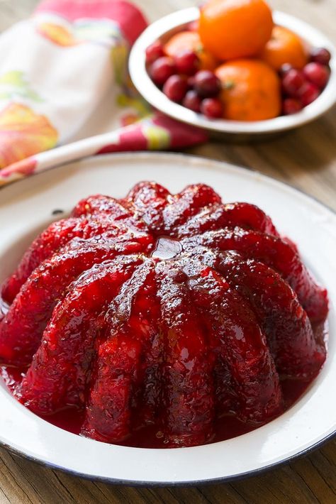 Raspberry gelatin is combined with cranberry sauce, pineapple and orange zest for a delicious side dish or dessert that's perfect for the holidays. Cranberry Jello Salad, Pineapple Jello, Cranberry Salad Recipes, Cranberry Jello, Gelatin Salad, Chicken Honey, Cranberry Thanksgiving, Jello Mold Recipes, Jellied Cranberry Sauce