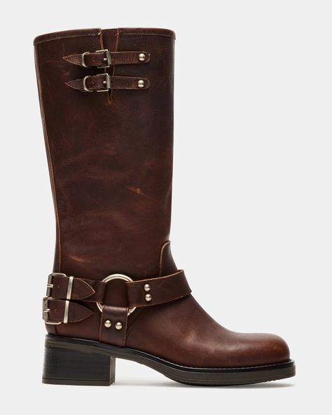 The ASTOR square toe boot features a slouchy mid-calf silhouette reinforced with strap accents and substantial buckle hardware. A wide sole with a block heel provides a solid foundation for this engineer-inspired design. Square toe block heel engineer boot Slip-on style Heel harness strap with hardware Top gore with 2 buckle straps for adjustable fit 2 inch heel height Size 6 measurements: 13.75 inch shaft circumference, 11.5 inch shaft height Size 8 measurements: 14 inch shaft circumference, 12 inch shaft height Size 10 measurements: 15 inch shaft circumference, 13 inch shaft height Leather upper material Leather lining Leather sock Synthetic sole This product is made with premium leather and is individually hand finished. As a result, the product can vary slightly from the pictures. Fit Brown Boots Outfit Knee High, Dark Brown Leather Boots, Brown Leather Knee High Boots, Tall Brown Leather Boots, High Quality Boots, Boots For Fall, Brown Knee High Boots, Tall Brown Boots, Engineer Boots