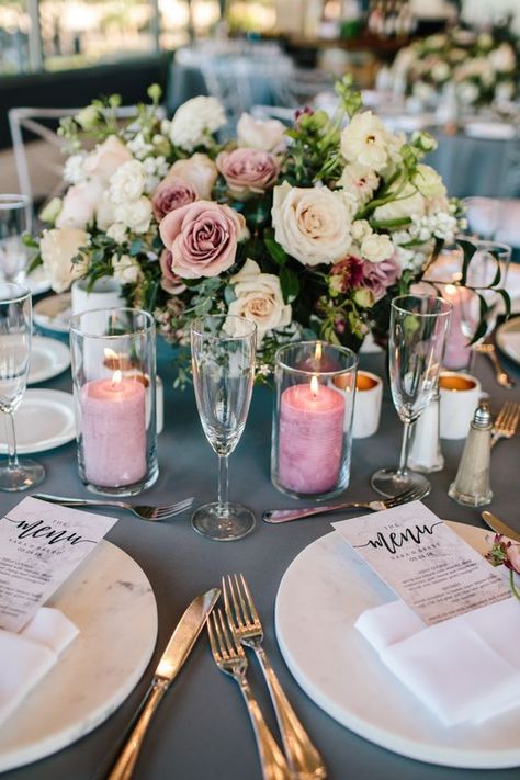 4+ Must See Hottest Mauve Wedding Decorations for Your Upcoming Day- glass candles wedding centerpieces, Japanese Ranunculus, Coloured Pillar Candles, Marble Vases, Wedding Flower Centerpieces, Mauve Wedding Colors, Heather Wedding, Mauve Blush, Mauve Wedding, Low Centerpieces