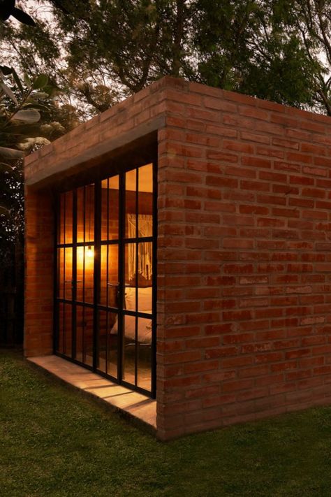 The tiny house was designed as a weekend getaway. Small Brick Building, Brick Tiny House, Tiny Brick House, Passive Heating, Brick Wall Living Room, Co Housing, Passive Solar Design, Solid Brick, Solar Design