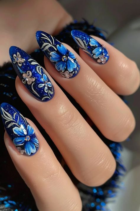 Discover an exquisite nail art design that effortlessly blends elegance with allure. Embrace the beauty of blue floral nail art for a sophisticated and captivating manicure. Elevate your style with this chic and feminine look, exuding a sense of grace and charm. The perfect choice for those who appreciate subtle yet striking aesthetics. Let your nails make a statement with the mesmerizing combination of cool blue hues intertwined with delicate floral patterns. Experience the beauty of understate Dark Floral Nail Designs, Neutral Blue Nails, Blue Nails Medium Length, Matt Nails, Mint Green Nails, Simple Spring Nails, Easter Nail Art, Floral Nail Designs, Floral Nail