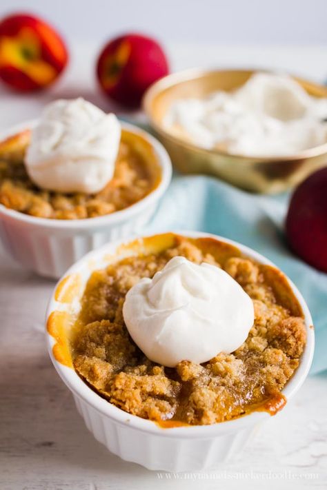 Mini Peach Crisps are super easy to make and taste fantastic!  Especially with a scoop of ice cream!  |  mynameissnickerdoodle.com Mug Peach Crisp, Peach Crisp For 2, Peach Crisp In A Mug, Individual Peach Crumble, Peach Crumble For Two, Peach Desserts For Two, Peach Crisp Small Batch, Peach Crisp For Two, Individual Peach Crisp