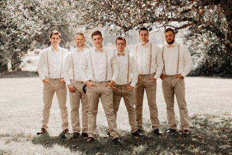 Backyard Bohemian Wedding in Sturgis, Michigan groomsmen in tan pants with suspenders and bowties . . . #bohowedding #bohemianstyle #wedindy #weddetroit #weddingpioneer #couplesphotographer #engagementsession #couplessession #michiganengagement #michiganphotographer #michiganwedding #michigananniversarysession #michiganelopement #michiganbeachsession #michiganweddingphotographer #indianaengagement #indianaphotographer #indianawedding #indianaweddingphotographer #kalamazoophotographer Groomsman Suspenders And Bowties, Tan Pants Groomsmen, Groomsmen Suspenders And Bowties, Groomsmen With Suspenders, Groomsmen Attire Suspenders, Boho Groomsmen, Khaki Groom, Casual Groomsmen Attire, Backyard Boho Wedding