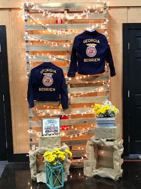 Decorations for FFA Banquet- displaying administrators' FFA jackets! Ffa Photo Booth, Ffa Jacket Display, Ffa Fair Booth Ideas, Ffa Banquet Centerpieces, Ffa Week Dress Up Days, Ffa Decorations Banquet, Ffa Backdrop, Ffa Graduation Party Ideas, Teacher Grad Party