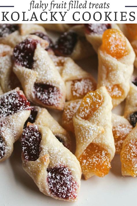 It wouldn’t be Christmas without some homemade kolacky cookies. The tender, flaky pasty is wrapped around fruit filling to make a tasty dessert. Whether you enjoy them warm or at room temperature, these pillowy delights are perfect for any occasion! Whip up a batch for your afternoon tea party or surprise your loved ones with a plateful of these irresistible treats to brighten their day. Cookies With Fruit Filling, Pinch Cookies Holidays, Flaky Polish Kolaczki, Cheap Fruit Desserts, Nut Roll Cookies Christmas, Cream Cheese Kolacky Cookies, Cresent Roll Cookies, Hungarian Cookies Christmas, Kolachy Cookies Recipe