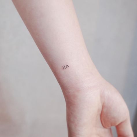 VII tattoo by @wittybutton_tattoo - Tattoogrid.net Vii Tattoo, Roman Numeral Wrist Tattoo, Meaningful Word Tattoos, Roman Tattoo, 7 Tattoo, Roman Numeral Tattoos, Small Meaningful Tattoos, Initial Tattoo, Tattoo Font