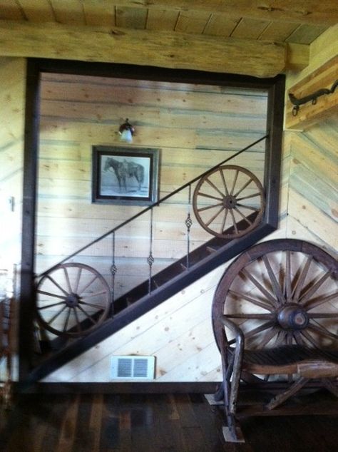 Our decor wheel incorporated into the stair railing - great Western decor idea! http://www.hansenwheel.com/store/wheels-repair/decor-antique-wheels/standard-wood-hub-wagon-wheel.html Wagon Wheel Railing, Metal Wagon Wheel Ideas, Wagon Wheel Decor, Wood Wagon, Ranch House Decor, Southwestern Home Decor, Western Bedroom Decor, Wagon Wheels, Theatre Props