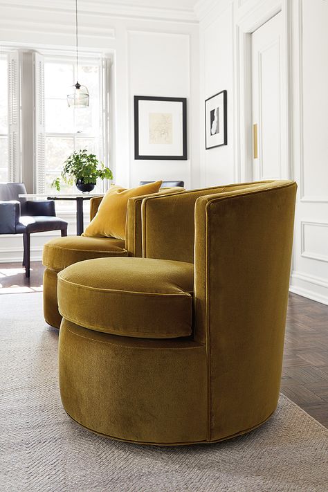 Modern Otis swivel chairs in velvet fabric. Our Otis chair is a modern version of the classic tub chair, so it’s a perfect bridge between the traditional style of this condo and the updated furniture within it. Otis is petite enough to fit in small spaces but is packed with comfort and features smooth-moving swivels. Not to mention, Otis looks great in pairs. Modern Swivel Chair, Upholstered Swivel Chairs, Swivel Chair Living Room, Modern Lounge Chairs, Sofa Living, Comfy Chairs, Modern Furniture Living Room, Cool Chairs, A Living Room