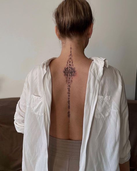 ✣ HANDPOKE TATTOO ✣ on Instagram: “Revealing your femininity 🌸🙏🏽 A lotus flower with the Green Tara mantra, a short Vasudhara mantra and an appeal to the radiant goddess…” Buddhism Tattoo, Tattoo Word Fonts, Flower Spine Tattoos, Spine Tattoo Ideas, Sak Yant Tattoo, Pretty Hand Tattoos, Handpoke Tattoo, Petite Tattoos, Spine Tattoos For Women