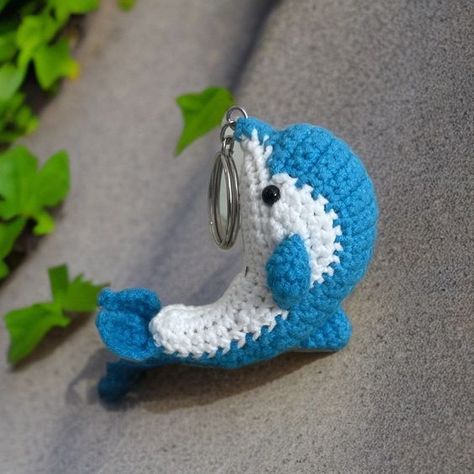 Crochet dolphin keychain, hanging dolphin, Cute dolphin, car hanging, desk decoration, cut #easycrochet, #amigurumi, #stuffedanimals, #smallcrochetprojects, #kawaiicrochet Crochet Dolphin Keychain Pattern Free, Crochet Turtle Pattern Free, Dolphin Crochet, Crochet Dolphin, Dolphin Keychain, Hanging Desk, Crochet Projects To Sell, Crochet Butterfly Free Pattern, Crochet Turtle Pattern