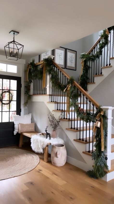 Townhouse Holiday Decor, Eucalyptus Garland Staircase, Stair Railing Holiday Decor, White Christmas Staircase Decor, Garland Stair Railing, Christmas Decor Ideas Stair Railing, Stair Rail Garland Christmas Decor, Stairwell Garland Christmas, Holiday Banister Ideas