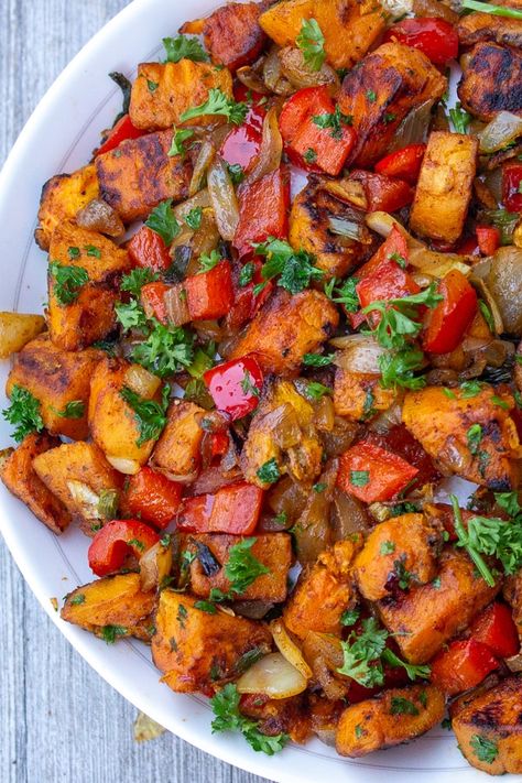 This quick and easy Vegetarian Sweet Potato Hash recipe with onions, garlic, peppers and smoked paprika is a delicious side, main, breakfast item or filling. #sweetpotatohash Sweet Potato And Bell Pepper Recipes, Roasted Sweet Potatoes And Peppers, Bell Pepper Sweet Potato Recipes, Sweet Potato Medley, Sweet Potato And Veggie Recipes, Sweet Potato With Veggies, Peppers And Sweet Potatoes, Sweet Potato Recipes Main Dish, Sweet Potato Peppers And Onions