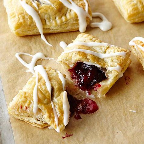 Cherry Pomegranate Danish: Tart filling bakes inside flaky puff pastry. For pink icing, use pomegranate juice instead of milk and butter. Pomegranate Pastries, Brunch Bread, Tart Filling, Pink Icing, Egg Recipes For Breakfast, Frozen Puff Pastry, Cherry Recipes, Puff Pastry Sheets, Egg Dish