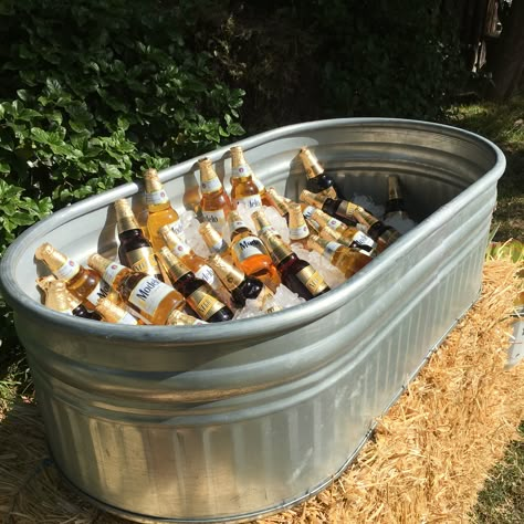 Our galvanized water trough makes for the perfect drink cooler Backyard Wedding Cooler Ideas, Galvanized Tub For Drinks At Wedding, Galvanized Tub Drink Station, Stock Tank Drink Cooler, Stock Tank Cooler Wedding, Wedding Beer Trough, Trough Drink Station, Water Trough Cooler Wedding, Water Trough Drink Cooler