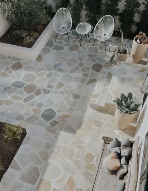 Back Patio Tile Ideas, Stone Flooring Outdoor Patio Ideas, White Stone Patio, Condo Patio Pebble Floor, Balcony Stone Flooring, Pebble Tile Outdoor Patio, Outdoor Spanish Tile, Pebbles Flooring Outdoor, Mexican Beach Pebbles With Pavers