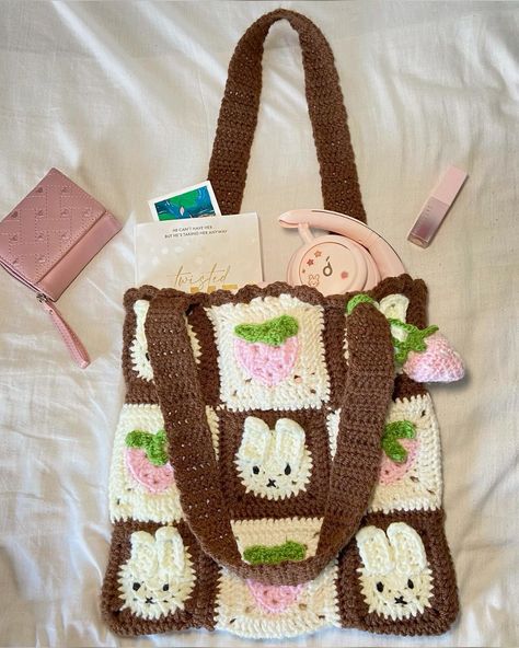 Creds to @sun_kissed_stitches on ig <3 Cutest granny square tote with miffy and strawberry squares. Comes with a strawberry charm. Cute miffy bag. Crochet bunny tote. Whimsical miffy design. Bunny-inspired tote. Unique crochet tote. Trendy bunny tote. Sustainable crochet tote. Eye-catching bunny design. Must-have miffy accessory. High-quality handmade tote bag. Shipping to republic of ireland only. Bunny Crochet Bag, Miffy Crochet Bag, Miffy Granny Square, Bunny Granny Square, Strawberry Squares, Miffy Bag, Miffy Crochet, Granny Square Tote, Tote Crochet