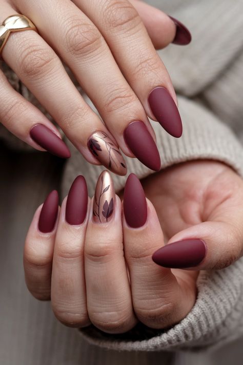 Transform your autumn look with these chic matte fall nail ideas that perfectly capture the essence of the season. Imagine rich burgundy and burnt orange nails featuring a velvety matte finish, evoking the warm colors of fallen leaves. This style is not only trendy but also adds a cozy touch to your outfits. Embrace the beauty of fall and let your nails make a statement with this elegant matte design. Matte Wine Nails Design, Almond Shaped Autumn Nails, Autumn Coffin Nail Ideas, Fall Season Nails Matte, Matte Nails Fall Colors, Elegant Burgundy Nails, Matte Fall Nails Almond, Matte Gel Nails Ideas, Matte Burgundy Nails Design